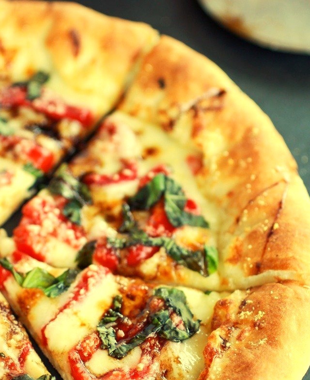 Green Olive Pesto Pizza with Feta Stuffed Crust, Roasted Red Peppers and Balsamic Drizzle